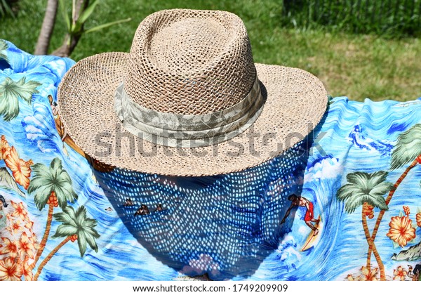Straw hat and Hawaiian\
shirt
