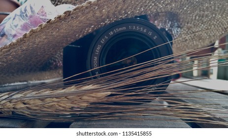 straw hat and reflex camera 
