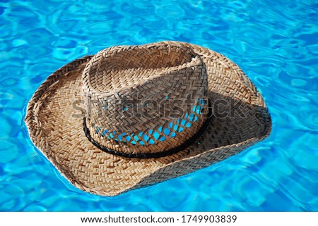 straw hat swimming pool holiday relax vacation blue water summer hotel resort skin care beach travel Swimmingpool uv skin care sunburn