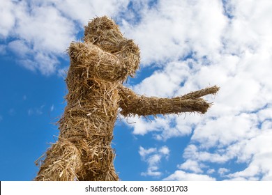 Straw Sculpture Of A Man On The Sky Background