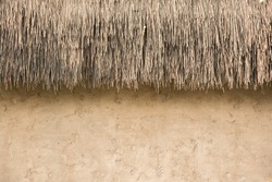 Straw Thatched Roof  And  Soil Wall  Earth Tone Background