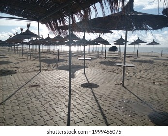 Straw Umbrellas At The Adriatic Beach In Winter, Durres, Albania