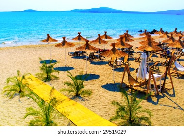 Straw Umbrellas On Beautiful Sunny Beach In Bulgaria