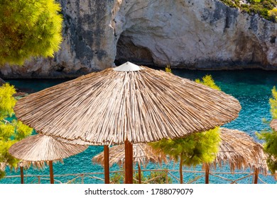 Straw umbrellas on Porto Limnionas beach. Zakynthos island, Greece