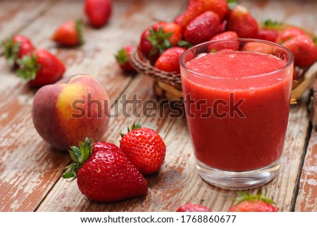Strawberries, bananas and peaches smoothie. Super delicious and  healthy. Let's try it! Summer vibes, close-up, top view