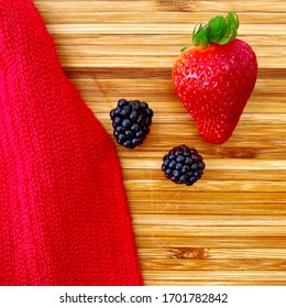 Strawberries And Blackberries On A Wooden Kitchen Counter. Ingredients For Baking A Summer Berry, Strawberry And Blackberry Pie Or Tart. Top Down Flat Lay View. Red And Summery Food