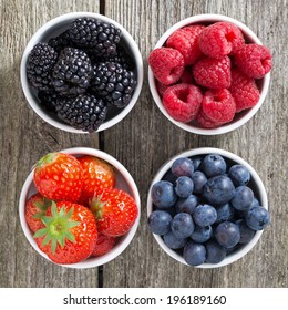 Strawberries, Blueberries, Blackberries And Raspberries In Bowls, Top View, Close-up