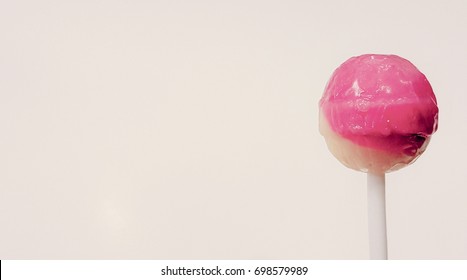 Strawberries and milk flavour lollipop on white background, retro effect. 