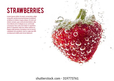 Strawberries in mineral water isolated on white background