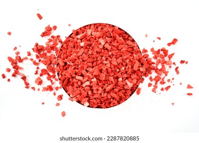 Strawberries on white background. Strawberries texture. dehydrated, dried Strawberry pieces, coarse cuts, chips. Heap of freeze dried strawberries. sweet fruit background. Red background stock image.