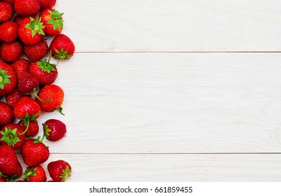 Strawberries On Wooden Background