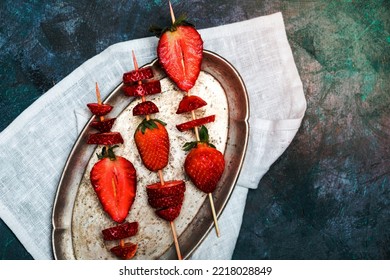 A Strawberries On Wooden Skewers