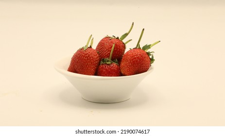 Strawberries Are Placed In A Small White Plate.