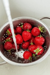 Washing strawberries underwater in | Food Images ~ Creative Market