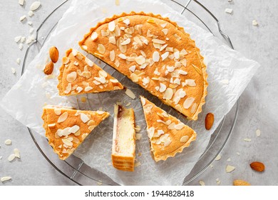 Strawberry Almond Bakewell Tart. Traditional British cuisine. Light gray background,top view.