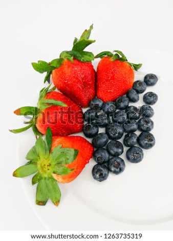 Similar – Bowl with red berries and mint leaves