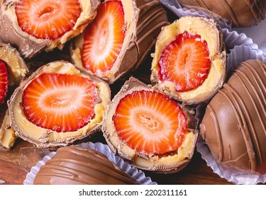 Strawberry bonbon in close-up photo. Brazilian sweet. Brazilian dessert with name in Brazilian Portuguese language of bombom de morango.
