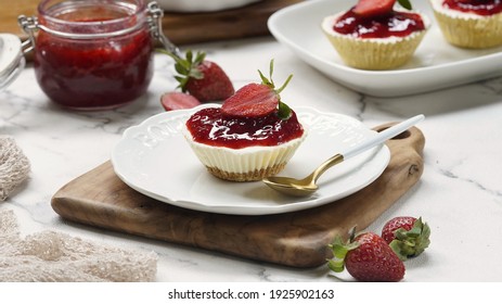 Strawberry cheese cake made from biscuit crumbs and cream cheese and then topped with strawberry jam.