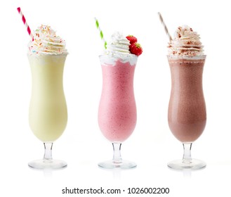 Strawberry, chocolate and vanilla milkshake with whipped cream isolated on white background