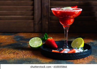 Strawberry cocktail with lime and ice cubes. Space for text. Top view - Powered by Shutterstock