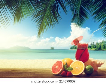 Strawberry Cocktail And Tropical Fruit On The Beach