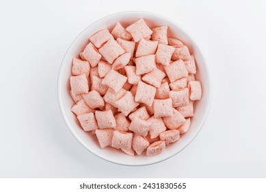 Strawberry corn pads in white bowl isolated on white background. Strawberry pillows.  crispy corn flakes. Top view Strawberry corn pads. cereals and milk. Healthy breakfast. - Powered by Shutterstock