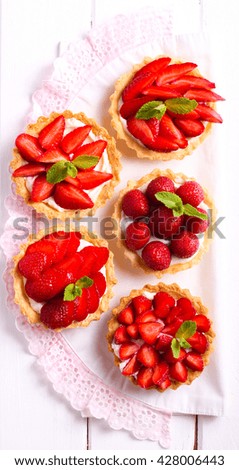 Similar – Image, Stock Photo Delicious strawberry tartlets with vanilla cream in heart shape