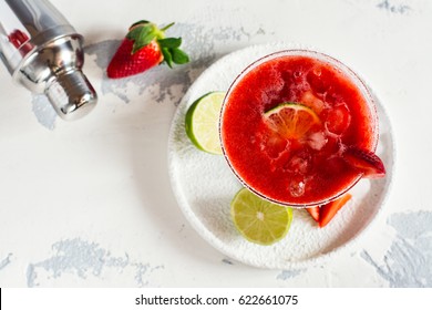 Strawberry daiquiri cocktail with lime and ice cubes. Space for text. Top view - Powered by Shutterstock