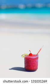 Strawberry Daiquiri Cocktail On A White Sand Beach