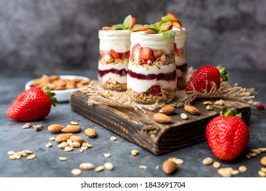 Strawberry Dessert Jar, yogurt fruit parfait topped with almonds - Shutterstock ID 1843691704