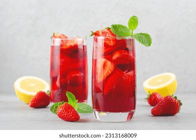 Strawberry Drink, Refreshing Cocktail, Lemonade, Iced Tea, Red Cold Summer Drink on Bright Background - Powered by Shutterstock