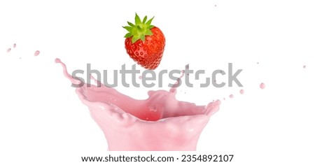 Strawberry falling into a milky pink splash isolated on white background. Studio photograph of strawberry yogurt, milkshake or smoothie.