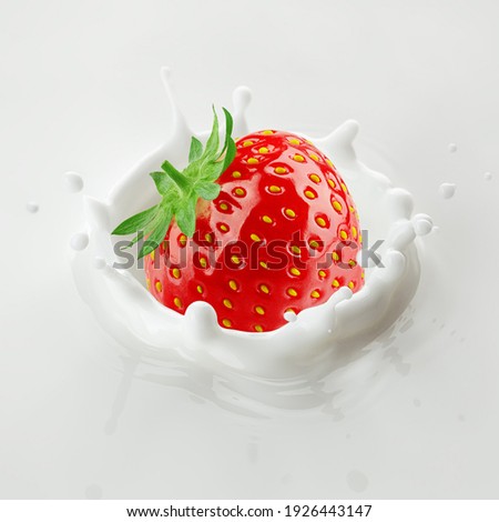 Strawberry falls into milk, yoghurt, sour cream, Splash
