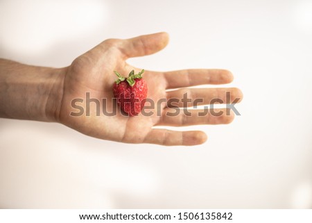 Similar – Woman holds strawberries in her hands