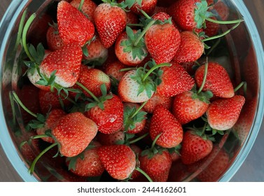 Strawberry. Fresh organic berries macro. Fruit background.Three strawberries with strawberry leaf on white background.Red strawberry in a bowl.Strawberry isolated. Strawberries with leaf isolate. 