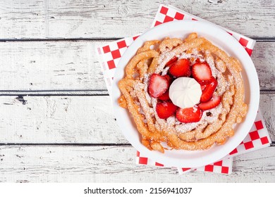 Strawberry Funnel Cake Above View Over A White Wood Background. Traditional Summer Carnival Treat.