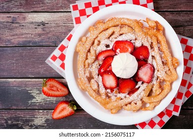 Strawberry Funnel Cake Top View Over A Dark Wood Background. Traditional Summer Carnival Treat.