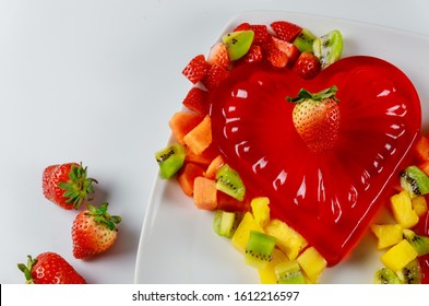 Strawberry heart shape gelatin with fruits on Valentines Day or wedding.