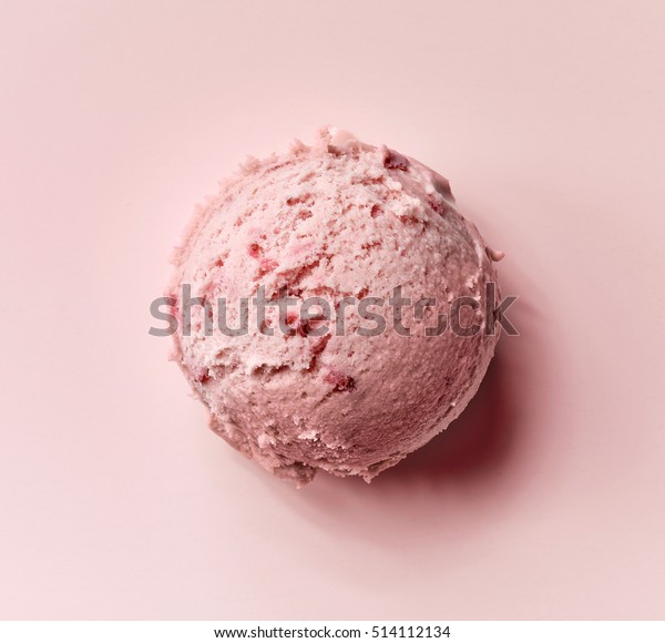 strawberry\
ice cream ball on pink background, top\
view