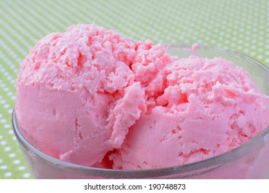 Strawberry ice cream in a glass bowl - closeup