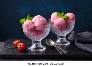 Strawberry Ice Cream In A Glass Bowl On Marble Cutting Board. Dark Background. 