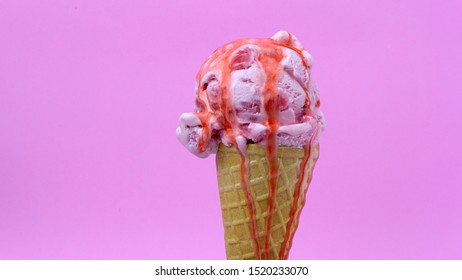  Strawberry ice cream scoop in waffle cone with  Strawberry sauce on pink background, Closeup Front view Food concept. - Shutterstock ID 1520233070