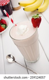 Strawberry Jelly, Banana, And Peanut Butter Smoothie Or Milkshake With Ingredients