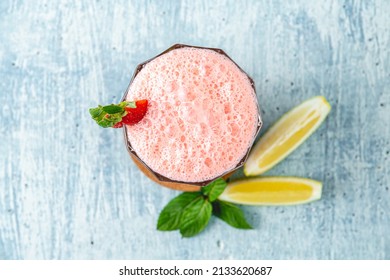 Strawberry And Lemon Milkshake Or Smoothie On Blue Stone Background