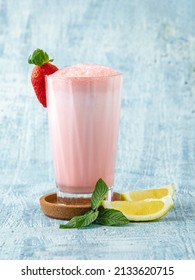 Strawberry And Lemon Milkshake Or Smoothie On Blue Stone Background