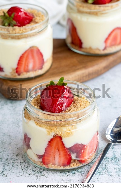 Strawberry\
magnolia. Dessert with cream and strawberry filling on a stone\
background. World cuisine delicacies. close\
up