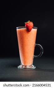 Strawberry Mango Smoothie On A Dark Background. Vertical Photo