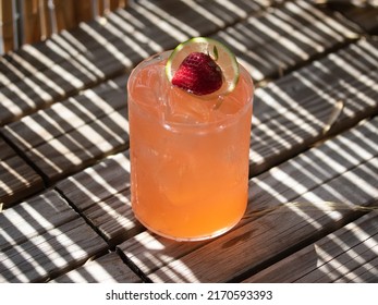 Strawberry Margarita On The Rocks On Wooden Boat Deck