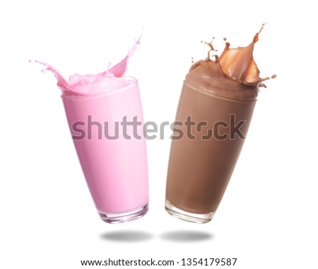 Strawberry milk and chocolate milk splashing out of glass isolated on white background.