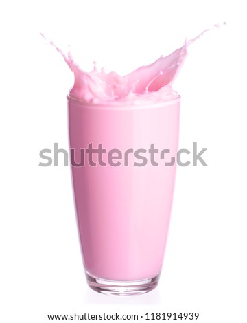 Strawberry milk splash out of glass isolated on white background.